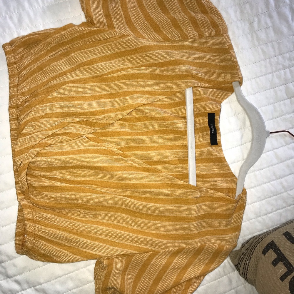 Golden/Yellow cropped top.